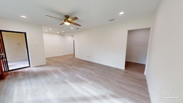 spare room with visible vents, light wood-style flooring, a ceiling fan, recessed lighting, and baseboards