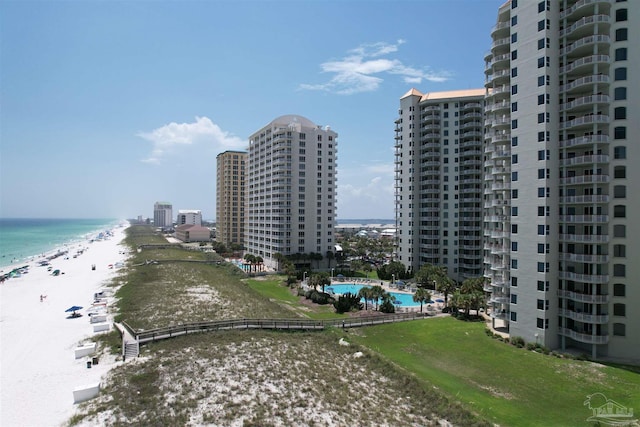 bird's eye view with a water view and a view of the beach