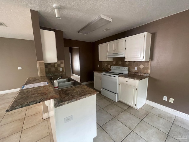 kitchen featuring electric range, backsplash, sink, and light tile patterned floors