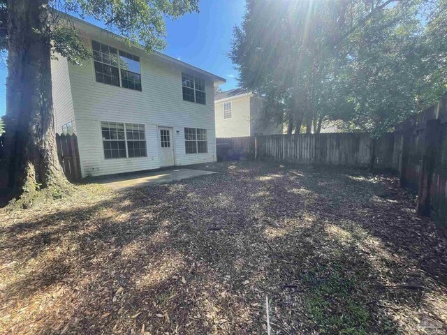 back of property with a patio area