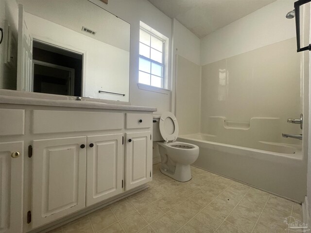 full bathroom featuring tile patterned floors, toilet, vanity, and tub / shower combination