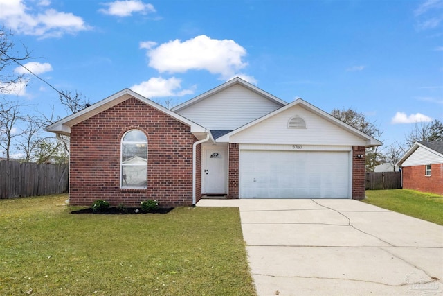 view of front of house with a garage and a front yard