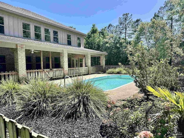view of swimming pool with a fenced in pool and fence