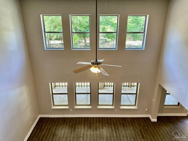 room details with carpet floors, baseboards, and ceiling fan