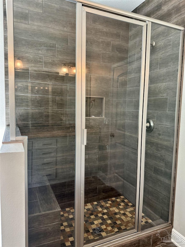 bathroom featuring a shower stall