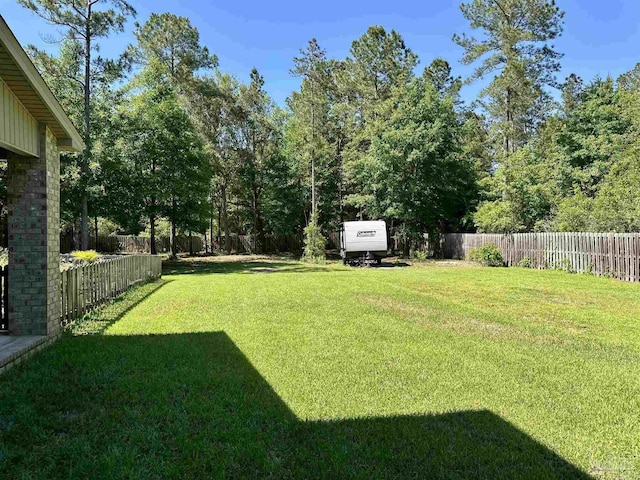 view of yard featuring a fenced backyard