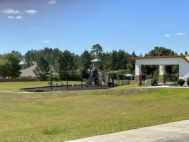 community jungle gym featuring a lawn