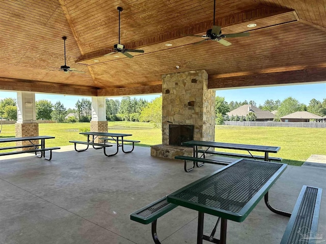 surrounding community featuring a lawn, fence, and a patio
