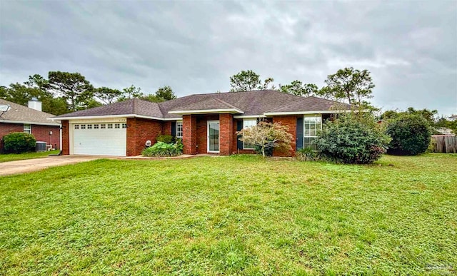 single story home with a garage, a front lawn, and central air condition unit