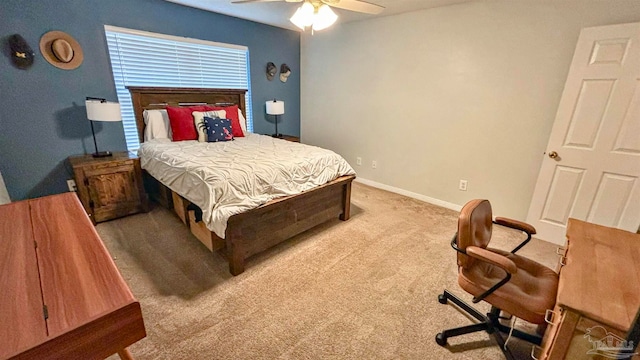 bedroom with ceiling fan and light carpet