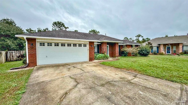 ranch-style house featuring a front yard and a garage