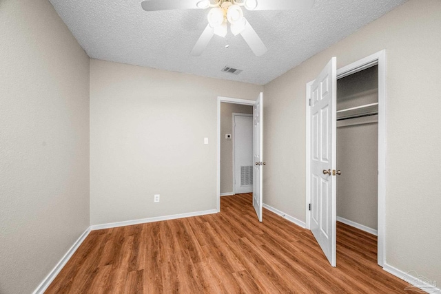 unfurnished bedroom with light wood-style floors, baseboards, and visible vents