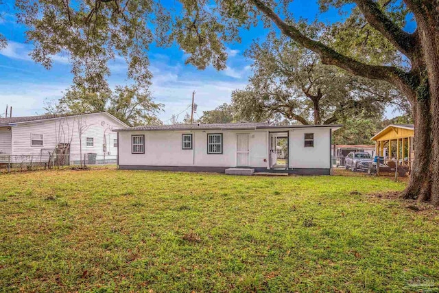 view of front of property with fence and a front yard