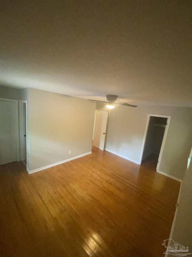 unfurnished room featuring hardwood / wood-style flooring