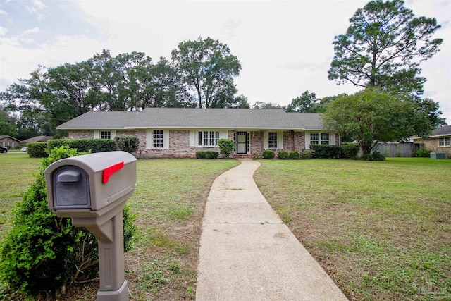 ranch-style home featuring a front yard