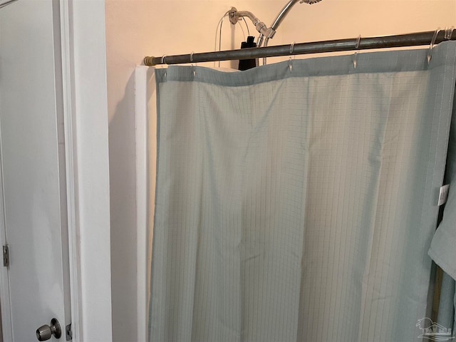 bathroom with curtained shower