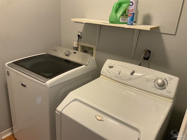 washroom featuring independent washer and dryer