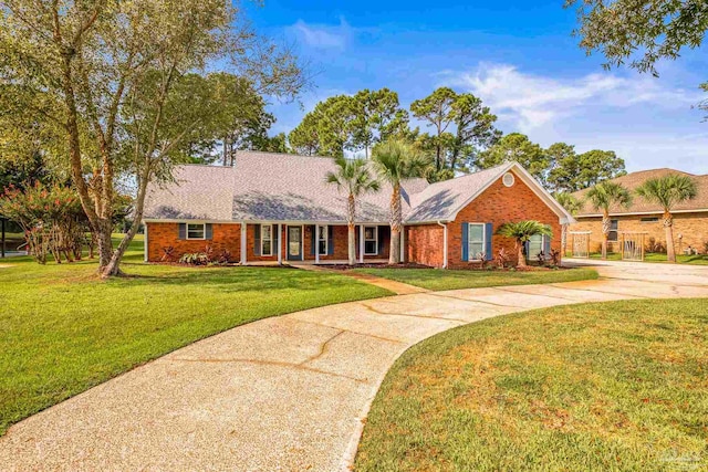 ranch-style home with a front yard