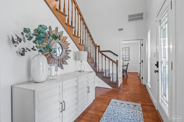 foyer entrance with hardwood / wood-style flooring