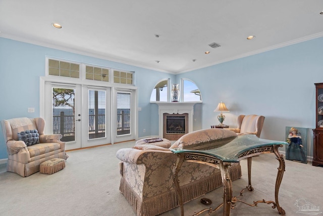 4757 Chinquapin Dr, Gulf Breeze, FL 32563 - carpeted living room with crown molding, baseboards, a glass covered fireplace, french doors, and recessed lighting