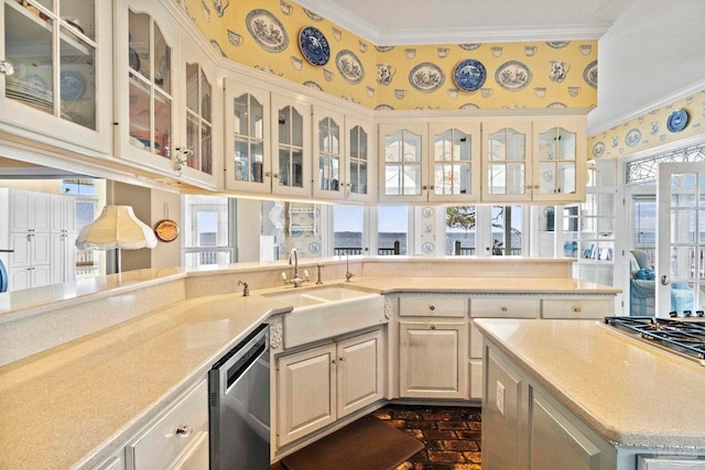 4757 Chinquapin Dr, Gulf Breeze, FL 32563 - kitchen featuring appliances with stainless steel finishes, crown molding, a sink, light countertops, and glass insert cabinets