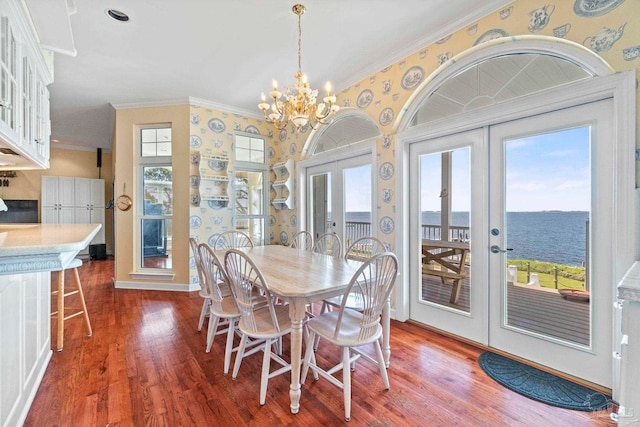 4757 Chinquapin Dr, Gulf Breeze, FL 32563 - dining area featuring french doors, dark wood finished floors, plenty of natural light, ornamental molding, and wallpapered walls