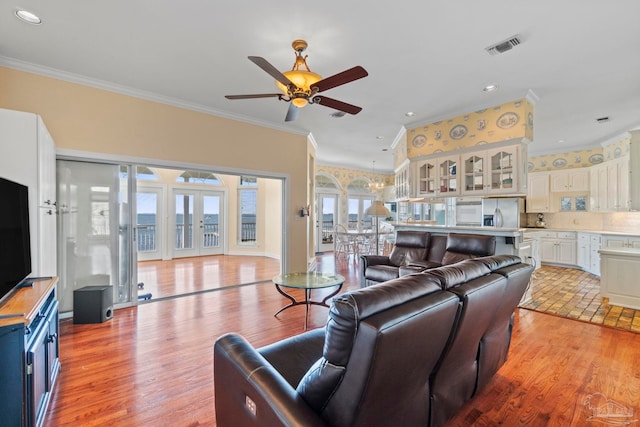 4757 Chinquapin Dr, Gulf Breeze, FL 32563 - living area with crown molding, ceiling fan, light wood finished floors, and recessed lighting