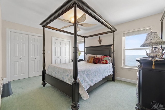 4757 Chinquapin Dr, Gulf Breeze, FL 32563 - bedroom featuring light carpet, multiple closets, a ceiling fan, and baseboards
