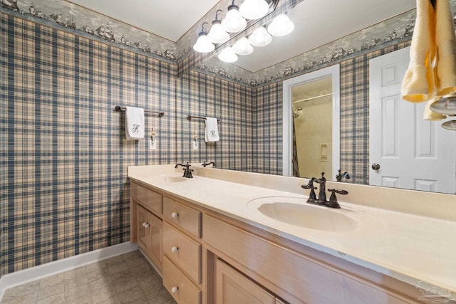 4757 Chinquapin Dr, Gulf Breeze, FL 32563 - full bath with double vanity, baseboards, wallpapered walls, and a shower with shower curtain