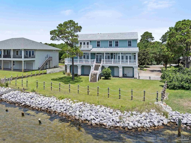 4757 Chinquapin Dr, Gulf Breeze, FL 32563 - back of house featuring a water view, stairs, and a sunroom