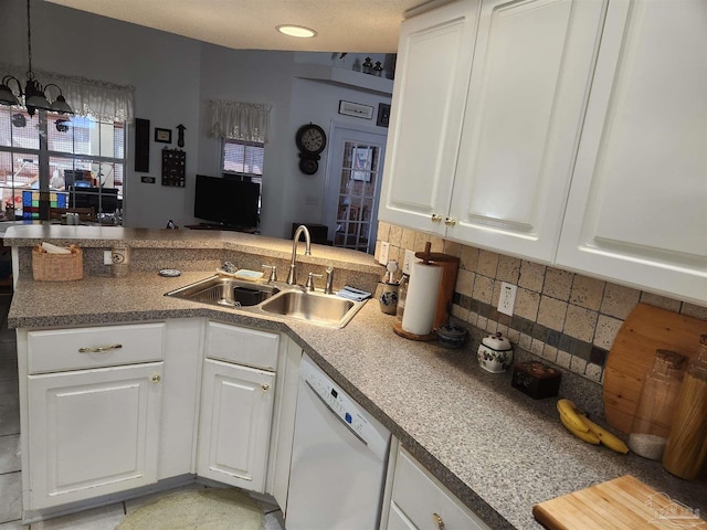 kitchen featuring white cabinets, white dishwasher, backsplash, and sink