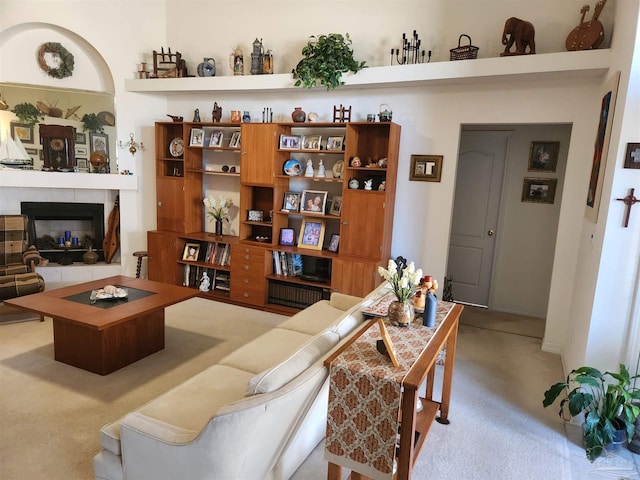 living room with a tile fireplace