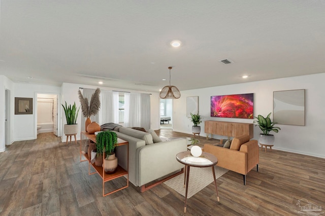 living room with dark hardwood / wood-style flooring