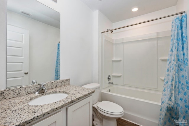 full bathroom with shower / bath combo, wood-type flooring, toilet, and vanity