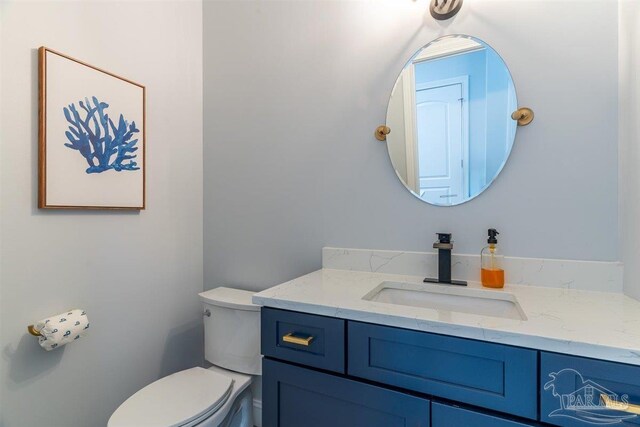 bathroom with vanity and toilet