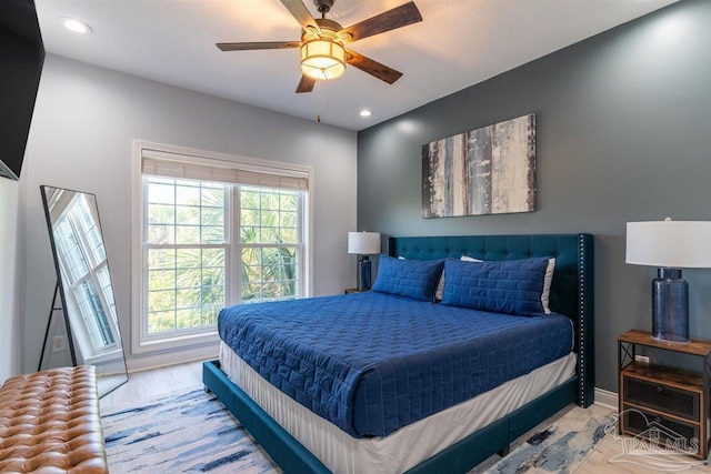 bedroom with recessed lighting, ceiling fan, and baseboards