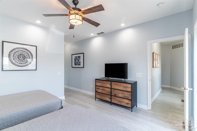 interior space with light hardwood / wood-style flooring and ceiling fan