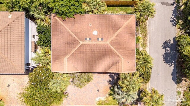 drone / aerial view with a beach view and a water view