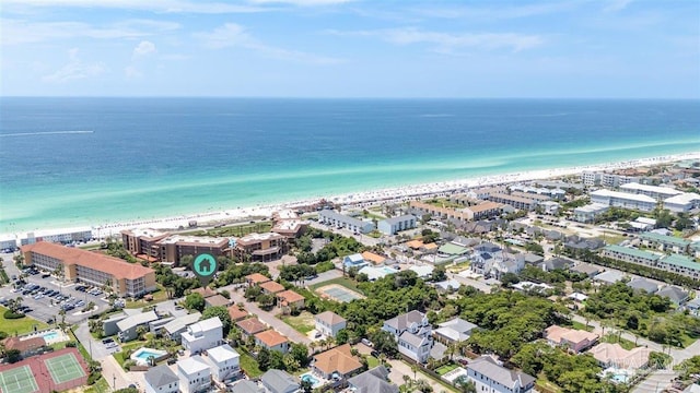 birds eye view of property featuring a beach view and a water view