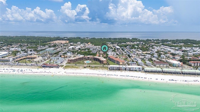 drone / aerial view featuring a view of the beach, a water view, and a view of city