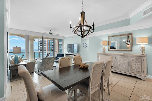 tiled dining area with ornamental molding and ceiling fan with notable chandelier