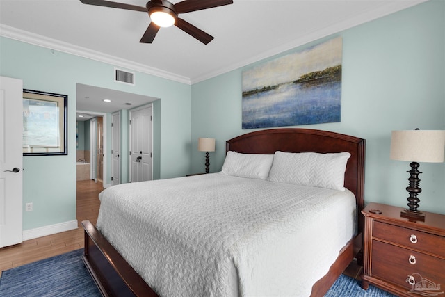 bedroom with ceiling fan, ornamental molding, dark hardwood / wood-style floors, and ensuite bath