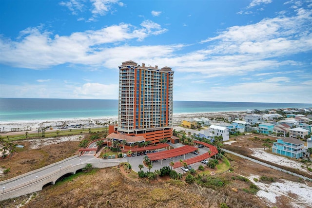 aerial view featuring a water view and a view of the beach