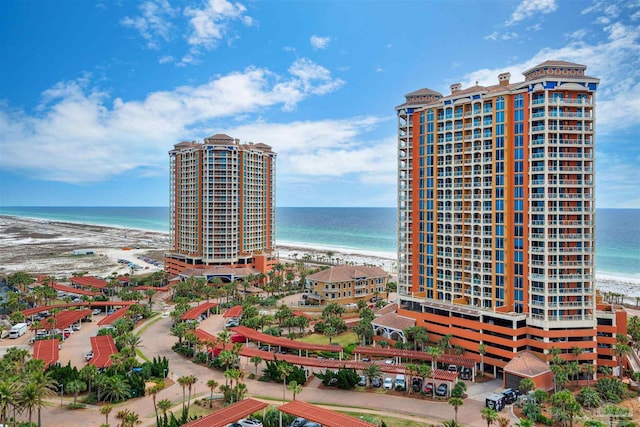 exterior space featuring a beach view and a water view