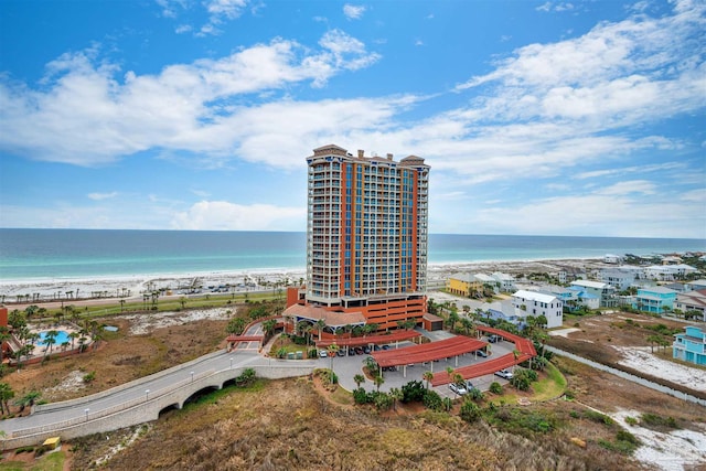 bird's eye view featuring a view of the beach and a water view