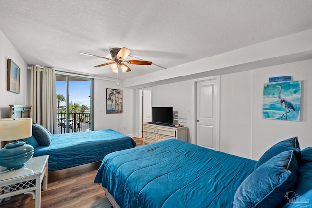 bedroom featuring a textured ceiling, access to outside, light wood finished floors, and ceiling fan