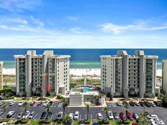 birds eye view of property featuring a view of the beach and a water view