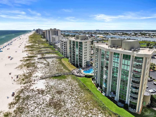 bird's eye view featuring a water view and a view of the beach