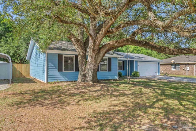 ranch-style house featuring fence, a front yard, driveway, and a garage