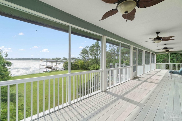 unfurnished sunroom with a water view